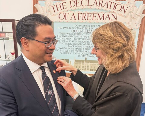 Freeman of the City of London lapel pin presented to Dr. Glenn Agung Hole beneath the Declaration of a Freeman
