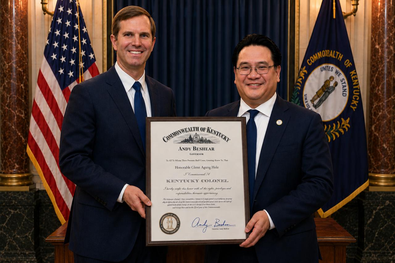 Dr. Glenn Agung Hole receiving the Kentucky Colonel commission from Governor Andy Beshear