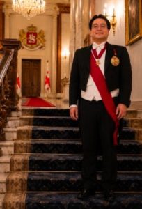 Dr. Glenn Agung Hole in formal regalia wearing the Grand Cross of the Eagle of Georgia