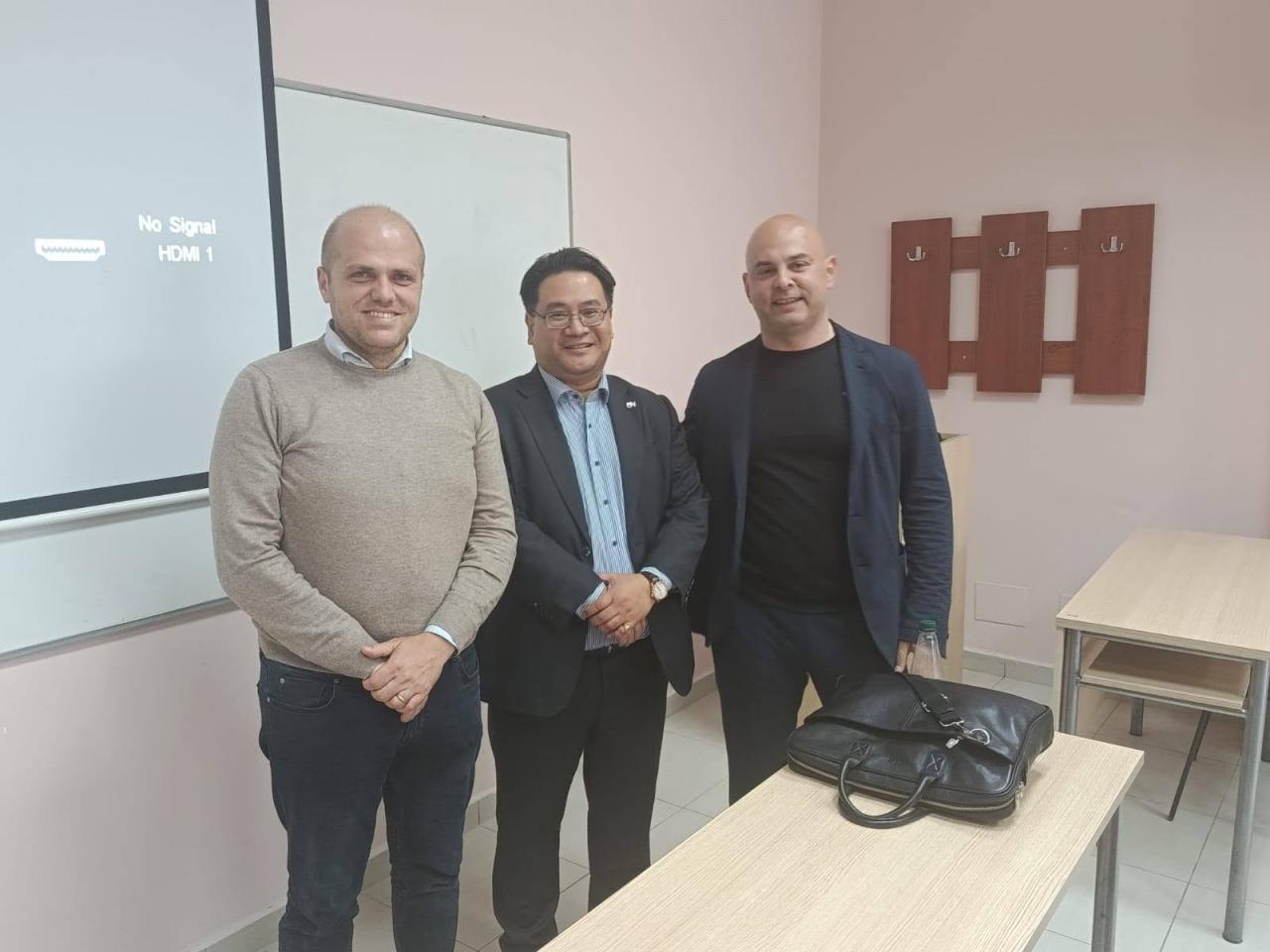 Dr. Glenn Agung Hole with academic colleagues in a classroom at the University of Shkodër