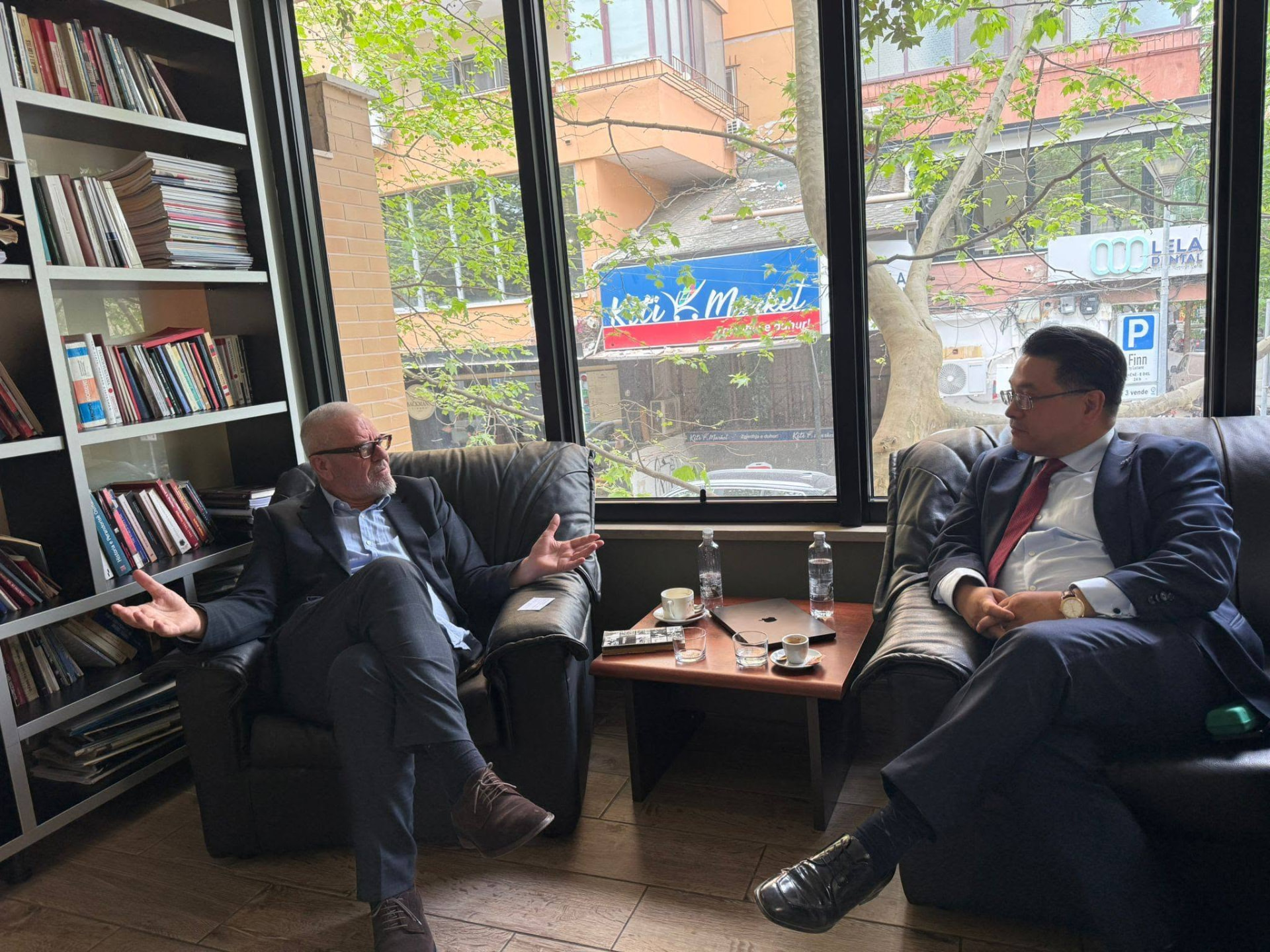Discussion on foreign policy and institutional economics at AIIS in Tirana